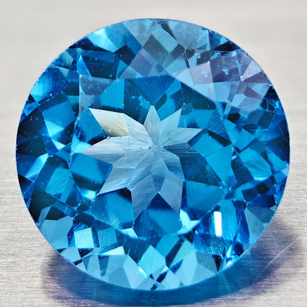 Natural Swiss Blue Topaz 3.43 Ct. VVS Round Shape 9 Mm. Gemstone From Brazil: Product ID: 807167741 Product Name: Natural Blue Topaz Weight: 3.43 CT. Size: 9 x 9 x 6 MM. Shape: Round Color: Swiss Blue Clarity:VVS Luster: Good Gems Origin: Brazil Treatment: Treated Crystal Struc