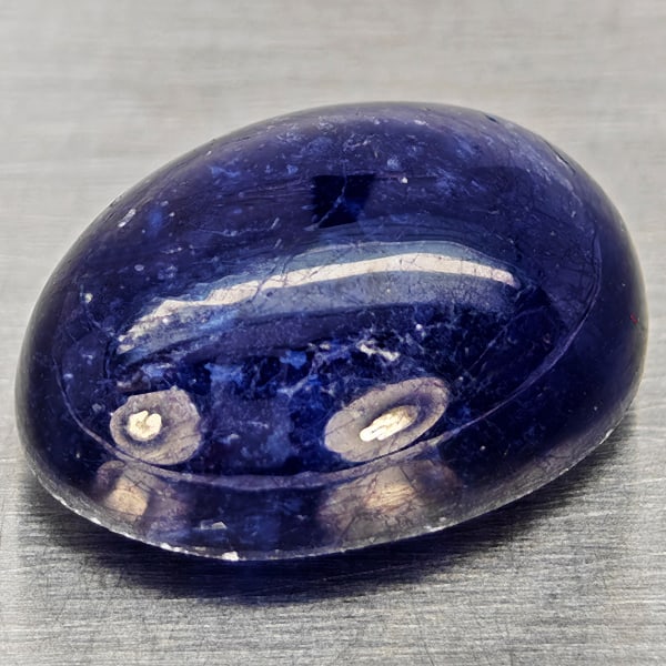 Natural Blue Sapphire 11.92 Ct. Oval Cabochon Shape 14.5 x 10.8 Mm Gemstone From Madagascar: Product ID: 806012355 Product Name: Natural Blue Sapphire Weight: 11.92 CT. Size: 14.5 x 10.8 x 7.3 MM. Shape: Oval Cabochon Color: Blue Clarity:Semi - Transparent Luster: Good Gems Origin: Madagascar