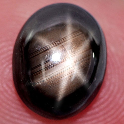 Natural Black Star Sapphire 6 Rays 3.88 Ct. Oval Cabochon Shape 10 x 8.4 Mm. Gemstone From Thailand: Product ID: 806135506 Product Name: Natural Star Sapphire Weight: 3.88 CT. Size: 10 x 8.4 x 4 MM. Shape: Oval Cabochon Color: Black Clarity:Opaque Luster: Good 6 Rays Star Gems Origin: Thailand Treatm