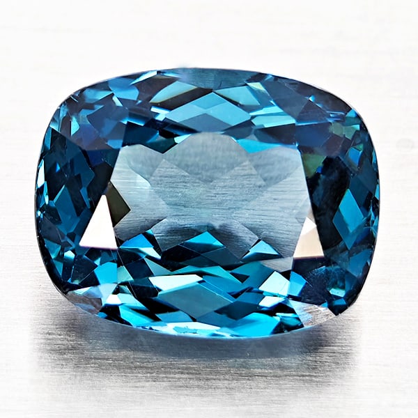 Natural London Blue Topaz 5.29 Ct. Cushion Shape 11.1 x 8.7 Mm Gemstone From Brazil: Product ID: 807168331 Product Name: Natural Blue Topaz Weight: 5.29 CT. Size: 11.1 x 8.7 x 6.4 MM. Shape: Cushion Shape Color: London Blue Clarity:VVS - VSI Luster: Good Gems Origin: Brazil Treatment: