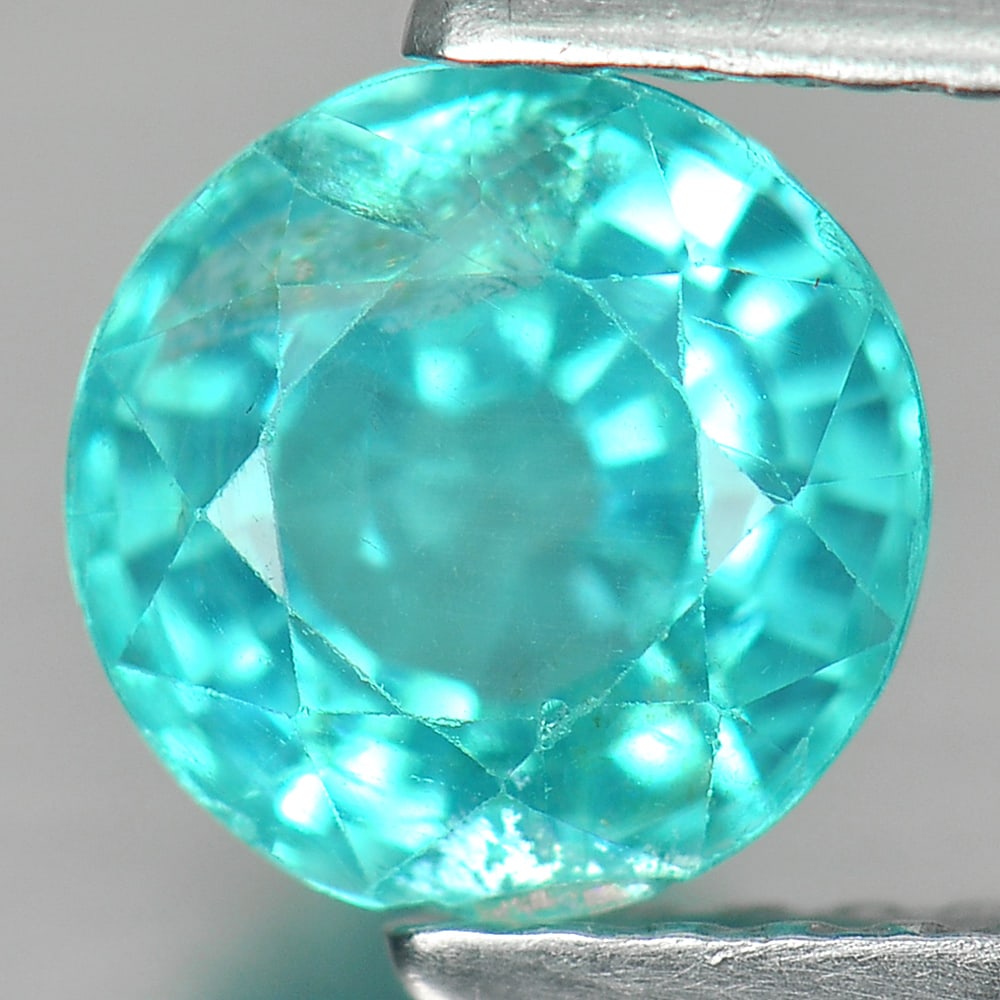 Natural Paraiba Color Apatite 1.26 Ct. Round Shape 6.4 Mm. Gemstone From Tanzania: Product ID: 100601102 Product Name: Natural Apatite Weight: 1.26 CT. Size: 6.4 x 6.4 x 4.3 MM. Shape: Round Color: Neon Blue Clarity:SI Luster: Good Gems Origin: Tanzania Treatment: Unheated Crystal S