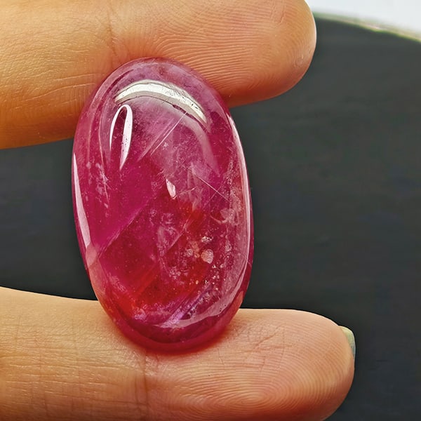 Natural Pink Red Ruby 60.97 Ct. Oval Cabochon Shape 31 x 18 Mm Gemstone From Madagascar: Product ID: 805935290 Product Name: Natural Ruby Weight: 60.97 CT. Size: 31 x 18 x 9.7 MM. Shape: Oval Cabochon Color: Purplish Red Clarity:Opaque Luster: Good Gems Origin: Madagascar Treatment: Heate