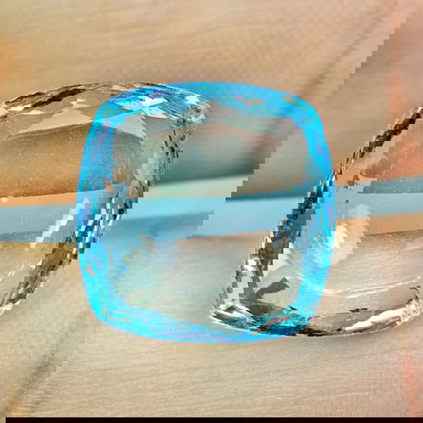 Natural Swiss Blue Topaz 6.74 Ct. Cushion Cabochon Shape 12.1 x 12.1 Mm. Gemstone From Brazil: Product ID: 807167894 Product Name: Natural Blue Topaz Weight: 6.74 CT. Size: 12.1 x 12.1 x 4.2 MM. Shape: Cushion Cabochon Color: Swiss Blue Clarity:VSI Luster: Good Gems Origin: Brazil Treatment: Tr