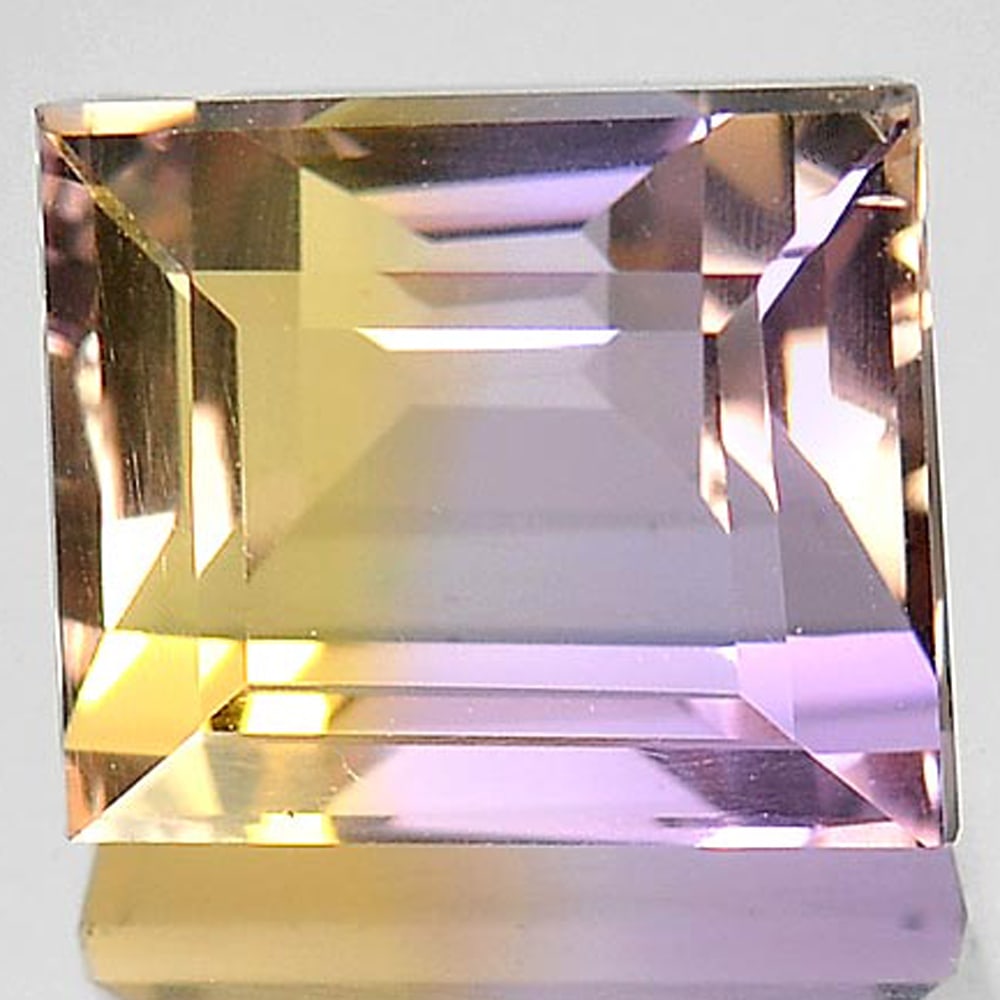 Natural Bi Color Ametrine 5.79 Ct. Clean Baguette Shape 10.3 x 9 Mm. Gemstone Unheated: Product ID: 800407335 Product Name: Natural Ametrine Weight: 5.79 CT. Size: 10.3 x 9 x 7.8 MM. Shape: Baguette Color: Bi-Color Clarity:IF Luster: Very Good Gems Origin: Bolivia Treatment: Unheated Cry