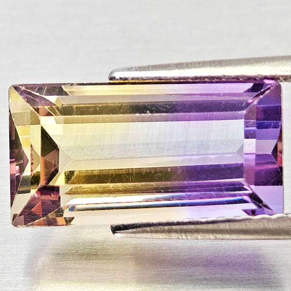 Natural Bi Color Ametrine 5.13 Ct. Octagon Shape 14.1 x 7.3 Mm Gemstone From Bolivia: Product ID: 800408352 Product Name: Natural Ametrine Weight: 5.13 CT. Size: 14.1 x 7.3 x 6.5 MM. Shape: Octagon Color: Bi Color Clarity:VSI Luster: Good Gems Origin: Bolivia Treatment: Unheated Crysta