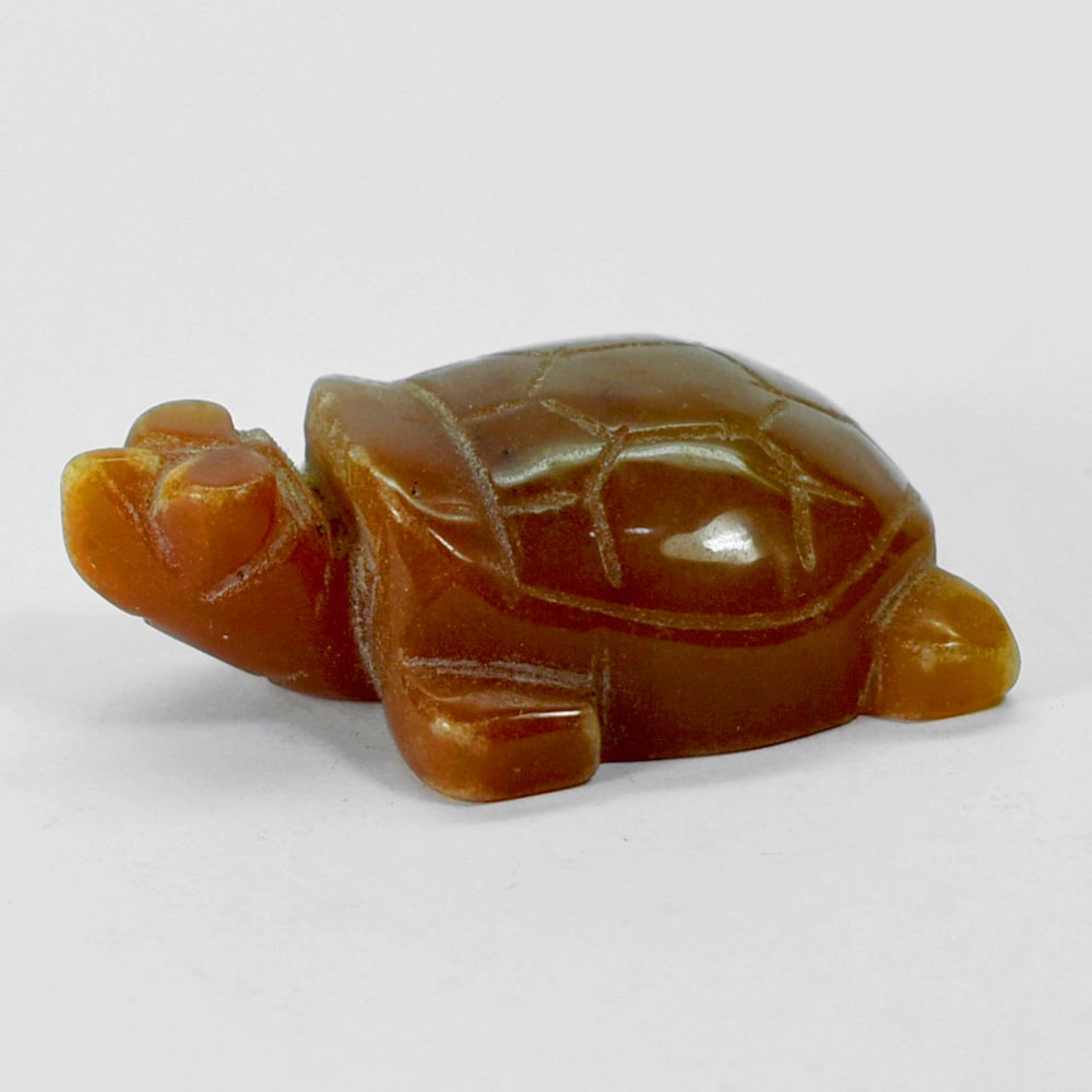 Natural Honey Jade Turtle Carving 180.48 Ct. Size 32 x 50 x 18 Mm. Gemstone: Product ID: 818102435 Product Name: Natural Gemstones Weight: 180.48 CT. Size: 32 x 50 x 18 MM. Shape: Caving Color: multi Color brown Honey Clarity:Opaque Luster: Good Gems Origin: Burma Treatment: U
