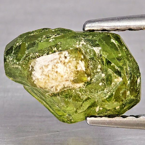 Natural Multi Color Green Demantoid Garnet 2.93 Ct. Rough Mixed Shape 9.6 x 7.5 Mm Gemstone From: Product ID: 802937420 Product Name: Natural Demantoid Weight: 2.93 CT. Size: 9.6 x 7.5 x 7 MM. Shape: Rough Mixed Shape Color: Multi-Color Green Clarity:None Luster: Good Gems Origin: Madagascar Treat