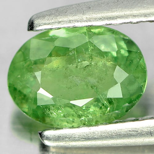 Natural Green Demantoid Garnet 0.80 Ct. Oval Shape 6.7 x 5 Mm. Gemstone From Madagascar: Product ID: 802919221 Product Name: Natural Demantoid Weight: 0.80 CT. Size: 6.7 x 5 x 2.7 MM. Shape: Oval Color: Green Clarity:SI Luster: Good Gems Origin: Madagascar , Africa Treatment: Unheated Cry