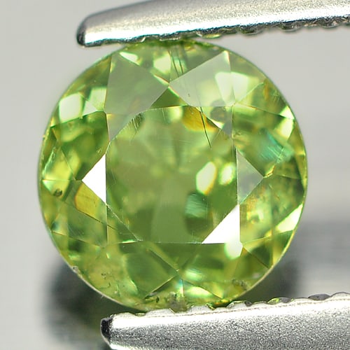 Certified Natural Green Demantoid Garnet 0.95 Ct. Round Shape 5.70 - 5.81 Mm. Gemstone Unheated From: Product ID: 802917099 Product Name: Natural Demantoid Weight: 0.99 CT. Size: 5.70 - 5.81 x 3.39 MM. Shape: Round Color: Green Clarity:SI Luster: Good Gems Origin: Madagascar , Africa Treatment: Unheat