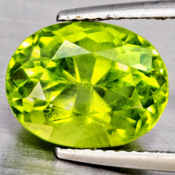 Natural Green Peridot 5.70 Ct. Oval Shape 11.6 x 9.1 Mm Gemstone From Pakistan: Product ID: 805317704 Product Name: Natural Peridot Weight: 5.70 CT. Size: 11.6 x 9.1 x 7.9 MM. Shape: Oval Color: Green Clarity:VSI Luster: Good Gems Origin: Pakistan Treatment: Unheated Crystal Stru