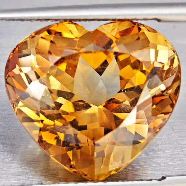 Natural Imperial Topaz 16.28 Ct. Heart Shape 15.6 x 14.2 Mm Gemstone From Brazil: Product ID: 807168613 Product Name: Natural Topaz Weight: 16.28 CT. Size: 15.6 x 14.2 x 10.6 MM. Shape: Heart Shape Color: Imperial Clarity:VSI Luster: Good Gems Origin: Brazil Treatment: Treated Crys