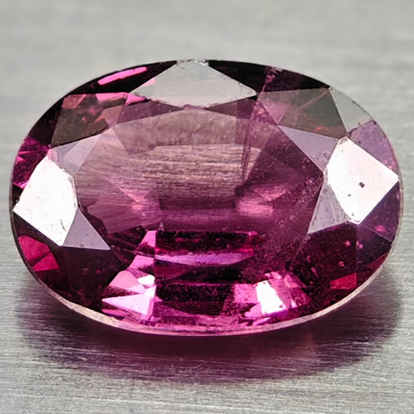 Natural Purplish Pink Rhodolite Garnet 0.96 Ct. Oval Shape 7.2 x 5.2 Mm Gemstone From Madagascar: Product ID: 102900083 Product Name: Natural Rhodolite Weight: 0.96 CT. Size: 7.2 x 5.2 x 2.7 MM. Shape: Oval Color: Purplish Pink Clarity:VSI Luster: Good Gems Origin: Madagascar Treatment: Unheated C