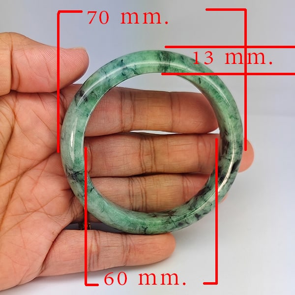 Natural Green Jade Bangle 300.95 Ct. Diameter 60 Mm. Gemstone from Thailand: Product ID: 819816145 Product Name: Natural Gemstones Weight: 300.95 CT. Size: 70 x 60 x 13 MM. Shape: Round Color: Multi-Color Green Clarity:Opaque Luster: Good Gems Origin: Thailand Treatment: Unhea