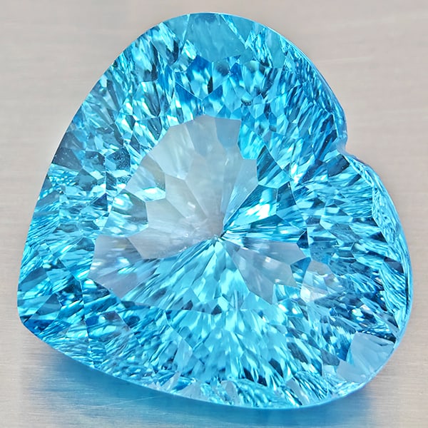 Natural Baby Blue Color Topaz 26.47 Ct. VVS Heart Concave Cut 19.3 x 18 Mm. Gemstone From Brazil: Product ID: 807168483 Product Name: Natural Blue Topaz Weight: 26.47 CT. Size: 19.3 x 18 x 12 MM. Shape: Heart Concave Cut Color: Baby Blue Color Clarity:VVS Luster: Very Good Gems Origin: Brazil Trea