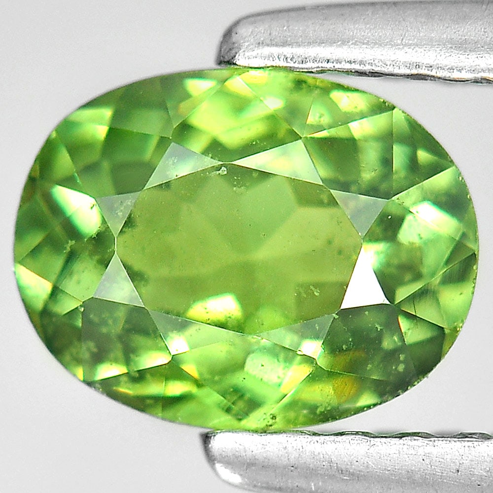 Natural Green Demantoid Garnet 0.97 Ct Oval Shape 6.7 x 5.2 Mm. Gemstone Unheated From Madagascar: Product ID: 802915761 Product Name: Natural Demantoid Weight: 0.97 CT. Size: 6.7 x 5.2 x 3.2 MM. Shape: Oval Color: Green Clarity:SI Luster: Good Gems Origin: Madagascar Treatment: Unheated Crystal St