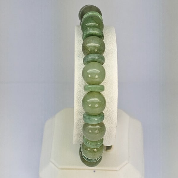 Natural Green Jade Beads Stretch Bracelet 153.13 Ct. Gemstone From Thailand: Product ID: 818102707 Product Name: Natural Jade Weight: 153.13 CT. Size: 2.5 x 9.5 MM. Shape: Round Cabochon Color: Multi-Color Green Clarity:Opaque Luster: Good Gems Origin: Thailand Treatment: Unhe