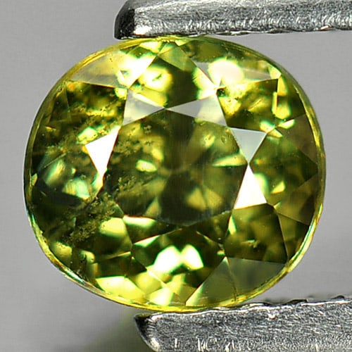 Natural Yellowish Green Demantoid Garnet 0.97 Ct. Oval Shape 5.7 x 5.2 Mm. Gemstone From Madagascar: Product ID: 802931382 Product Name: Natural Demantoid Weight: 0.97 CT. Size: 5.7 x 5.2 x 4 MM. Shape: Oval Color: Yellowish Green Clarity:SI1 Luster: Very Good Gems Origin: Madagascar Treatment: Unhea