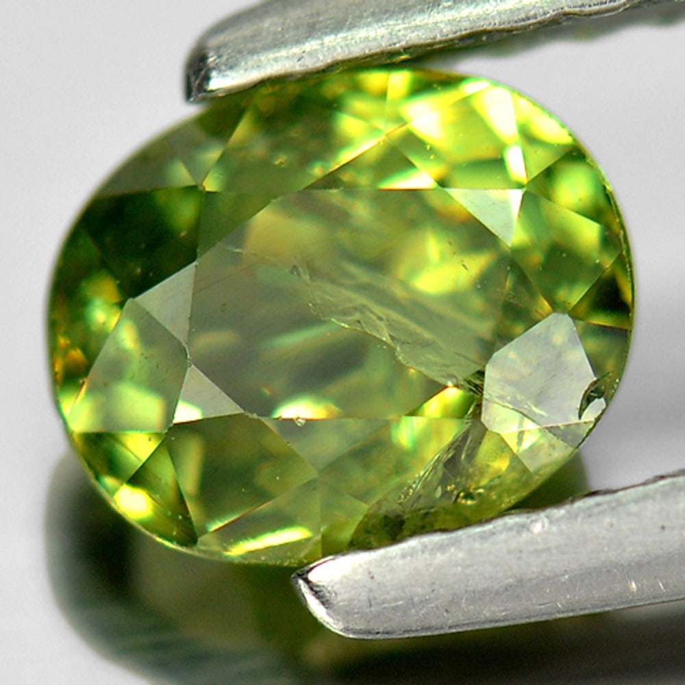 Natural Green Demantoid Garnet 0.96 Ct. Oval Shape 6.1 x 5 Mm. Unheated Gemstone From Madagascar: Product ID: 802915857 Product Name: Natural Demantoid Weight: 0.96 CT. Size: 6.1 x 5 x 3.5 MM. Shape: Oval Color: Green Clarity:SI1 Luster: Very Good Gems Origin: Madagascar , Africa Treatment: Unheat