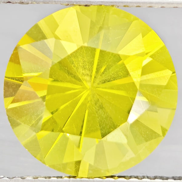 Natural Yellow Lemon Quartz 6.14 Ct. Round Diamond Cut 12.2 Mm Gemstone From Brazil: Product ID: 805530119 Product Name: Natural Quartz Weight: 6.14 CT. Size: 12.2 x 12.2 x 8.8 MM. Shape: Round Diamond Cut Color: Yellow Lemon Clarity:VSI Luster: Good Gems Origin: Brazil Treatment: Unh
