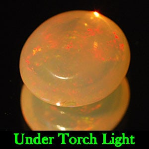 Natural Multi Color Opal 1.44 Ct. Oval Cabochon Shape 8.7 x 8 Mm Gemstone From Ethiopia: Product ID: 818710123 Product Name: Natural Opal Weight: 1.44 CT. Size: 8.7 x 8 x 4 MM. Shape: Oval Cabochon Color: Multi Color Clarity:Semi - Transparent Luster: Good Gems Origin: Ethiopia Treatment: