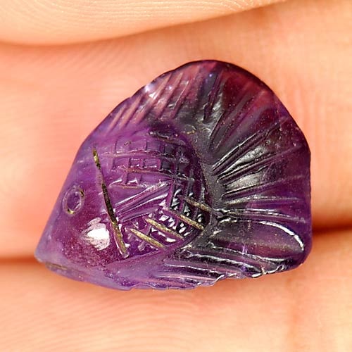Natural Purple Amethyst 5.89 Ct. Fish Carving Unheated Gemstone: Product ID: 810303507 Product Name: Natural Amethyst Weight: 5.89 CT. Size: 15.8 x 12 x 6.2 MM. Shape: Fish Carving Color: Purple Clarity:Semi - Transparent Luster: Good Gems Origin: Brazil Treatment: