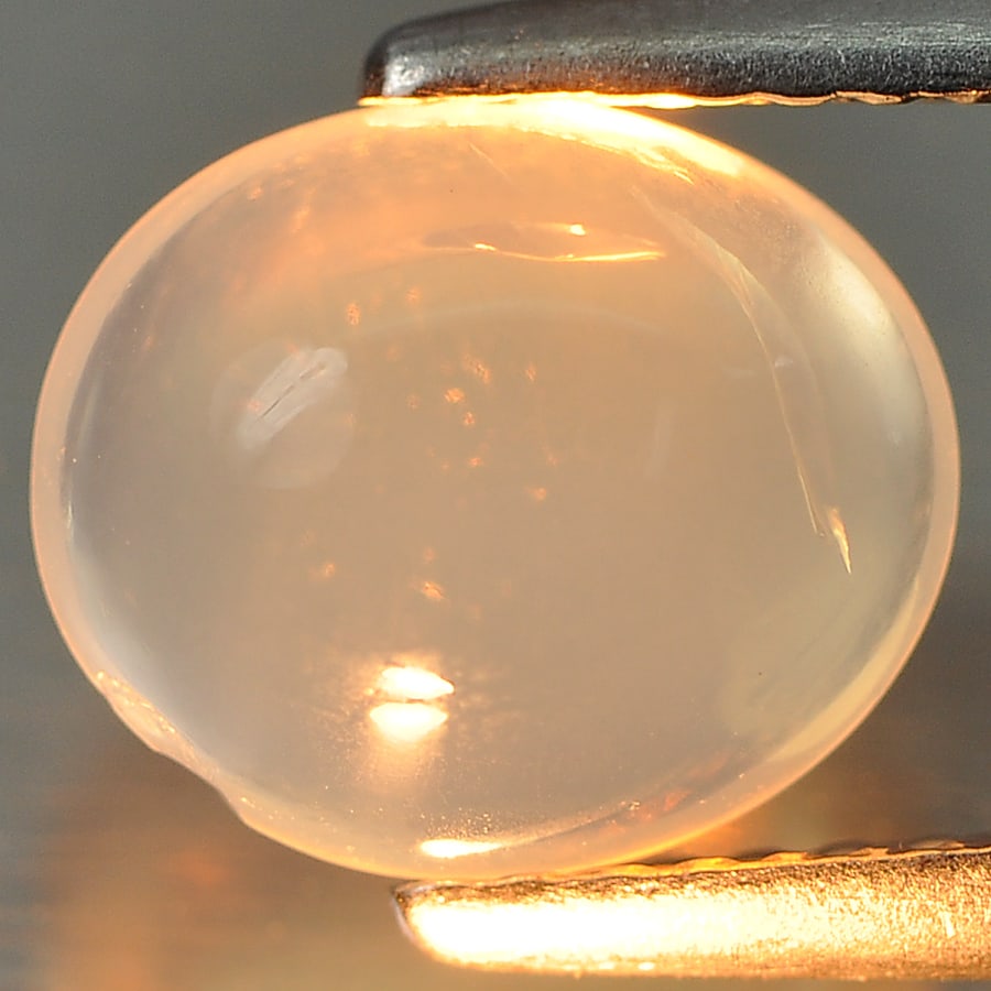 Natural White Opal 1.90 Ct. Oval Cabochon Shape 8.9 x 7.5 Mm Gemstone From Ethiopia: Product ID: 818716046 Product Name: Natural Opal Weight: 1.90 CT. Size: 8.9 x 7.5 x 4.9 MM. Shape: Oval Cabochon Color: White Clarity:Semi - Transparent Luster: Good Gems Origin: Ethiopia Treatment: U