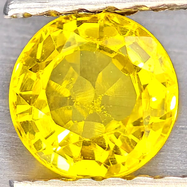 Natural Yellow Sapphire 0.61 Ct. Round Shape 4.9 Mm Gemstones From Thailand: Product ID: 806162958 Product Name: Natural Yellow Sapphire Weight: 0.61 CT. Size: 4.9 x 4.9 x 2.9 MM. Shape: Round Shape Color: Yellow Clarity:VSI Luster: Good Gems Origin: Thailand Treatment: Heated