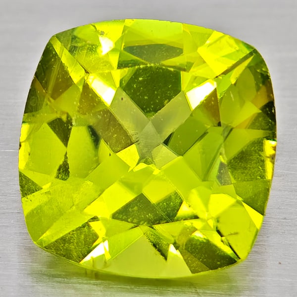 Natural Green Peridot 1.52 Ct. Cushion Shape 7.1 Mm Gemstone From Pakistan: Product ID: 805317222 Product Name: Natural Peridot Weight: 1.52 CT. Size: 7.1 x 7.1 x 4.3 MM. Shape: Cushion Shape Color: Green Clarity:VSI - SI1 Luster: Good Gems Origin: Pakistan Treatment: Unheate