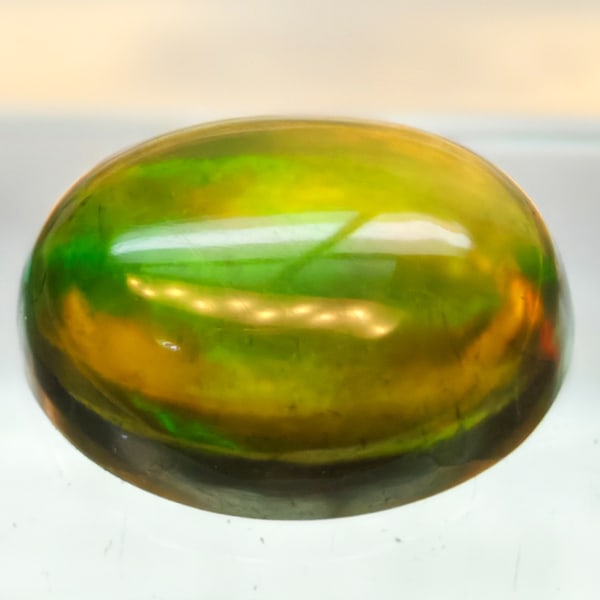 Natural Multi-Color Opal 1.39 Ct. Oval Cabochon Shape 8 x 6 Mm Gemstone From Ethiopia: Product ID: 818728036 Product Name: Natural Opal Weight: 1.39 CT. Size: 8 x 6 x 3.5 MM. Shape: Oval Cabochon Color: Multi-Color Clarity:Semi - Transparent Luster: Iridescent Gems Origin: Ethiopia Trea