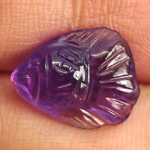 Natural Purple Amethyst 2.76 Ct. Fish Carving Shape 12 x 9.5 Mm. Gemstone from Brazil: Product ID: 810303889 Product Name: Natural Amethyst Weight: 2.76 CT. Size: 12 x 9.5 x 4.9 MM. Shape: Fish Carving Color: Purple Clarity:Semi - Transparent Luster: Good Gems Origin: Brazil Treatment: