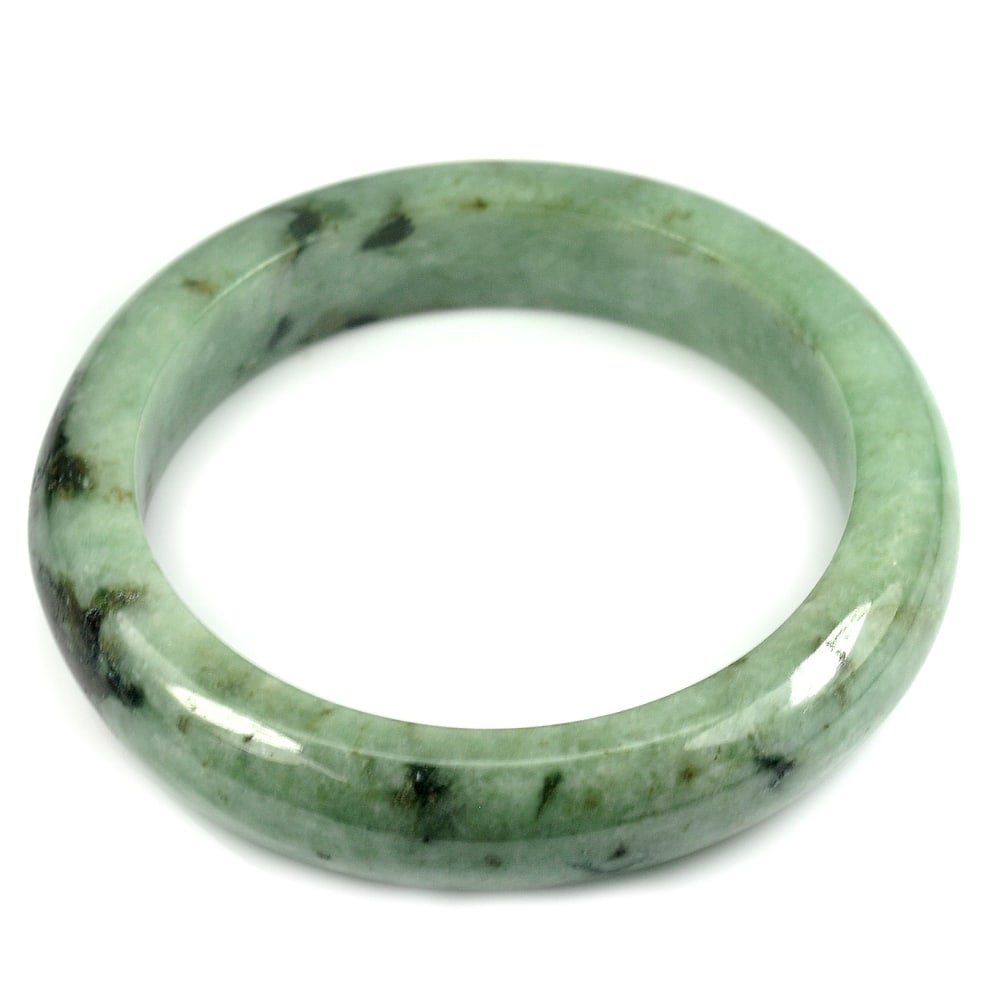 Natural Green Jade Bangle 475.00 Ct. Diameter 63 Mm. Gemstone From Thailand: Product ID: 819815303 Product Name: Natural Jade Weight: 475.00 CT. Size: 84 x 63 x 15 MM. Shape: Round Color: Multi Color Green Clarity:Opaque Luster: Good Gems Origin: Thailand Treatment: Unheated C