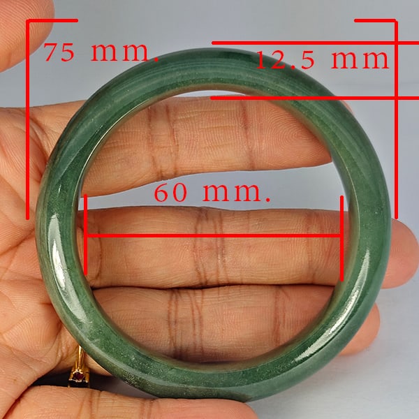 Natural Green Jade Bangle 300.75 Ct. Diameter 75 x 60 Mm Gemstone from Thailand: Product ID: 819816056 Product Name: Natural Gemstones Weight: 300.75 CT. Size: 75 x 60 x 12.5 MM. Shape: Round Color: Multi-Color Clarity:Opaque Luster: Good Gems Origin: Thailand Treatment: Unheated