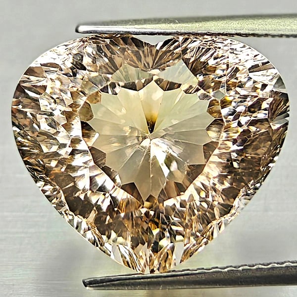 Natural Imperial Topaz 16.62 Ct. Heart Concave Cut 16.5 x 14.3 Mm Gemstone from Brazil: Product ID: 807168279 Product Name: Natural Topaz Weight: 16.62 CT. Size: 16.5 x 14.3 x 10.5 MM. Shape: Heart Concave Cut Color: Imperial Clarity:VSI Luster: Very Good Gems Origin: Brazil Treatment: U