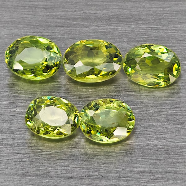 Natural Green Demantiod Garnet 1.10 Ct. 5 Pcs Oval Shape 4 x 3.2 Mm Gemstones From Madagascar: Product ID: 802937477 Product Name: Natural Demantoid Weight: 1.10 CT. Size: 4 x 3.2 x 2 MM. Shape: Oval Shape Color: Green Clarity:SI1 Luster: Good Gems Origin: Madagascar Treatment: Unheated Crystal