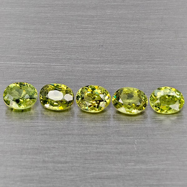 Natural Green Demantiod Garnet 1.12 Ct. 5 Pcs Oval Shape 4 x 3 Mm Gemstones From Madagascar: Product ID: 802937478 Product Name: Natural Demantoid Weight: 1.21 CT. Size: 4 x 3 x 2.3 MM. Shape: Oval Shape Color: Green Clarity:SI1 Luster: Good Gems Origin: Madagascar Treatment: Unheated Crystal