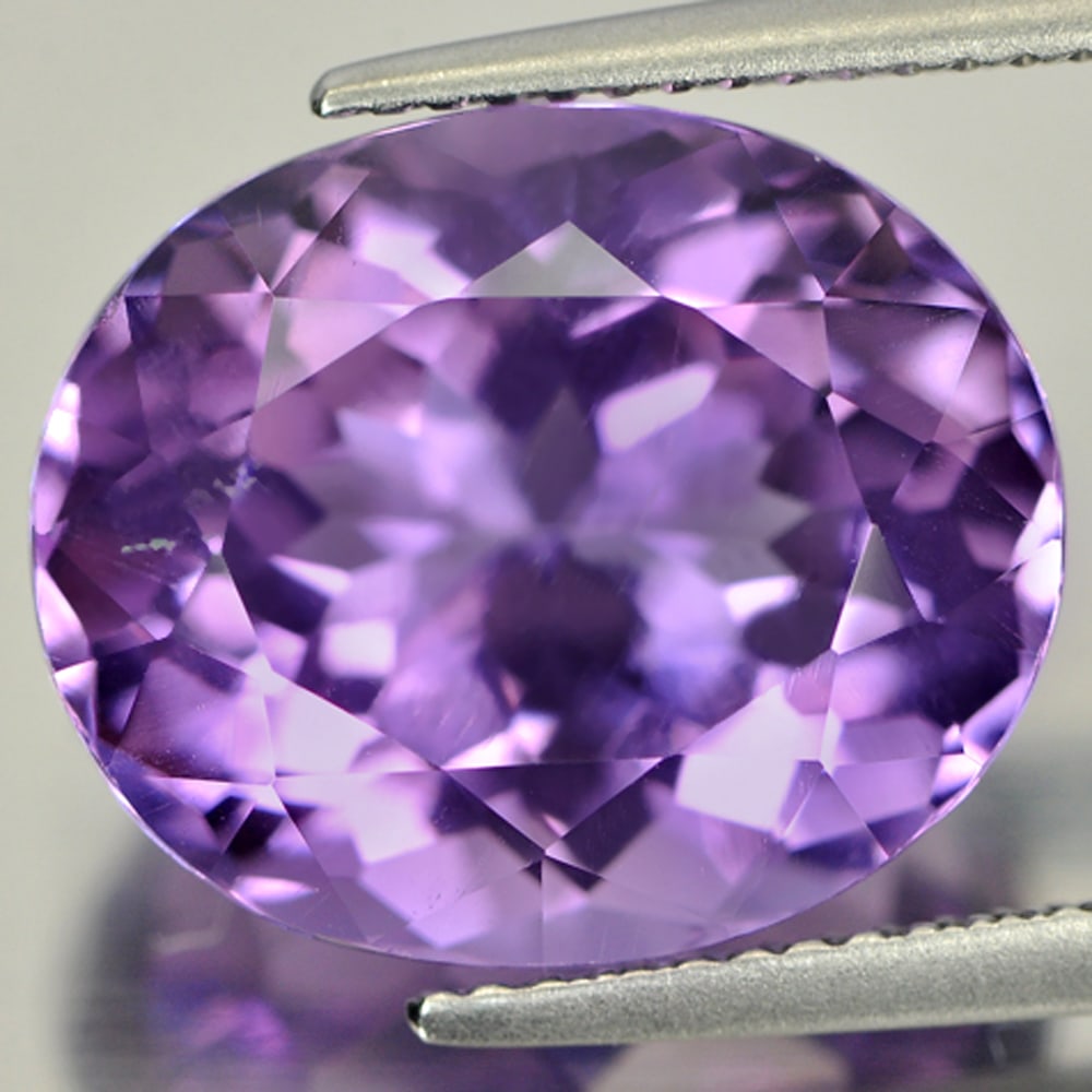 Natural Purple Amethyst 11.49 Ct. Oval Shape 15.4 x 12.9 Mm. Gemstone Unheated From Brazil: Product ID: 800320915 / Product Name: Natural Amethyst / Weight: 11.49 CT. / Size: 15.4 x 12.9 x 10.1 MM. / Shape: Oval / Color: Purple / Clarity:VSI / Luster: Good / Gems Origin: Brazil / Treatment: