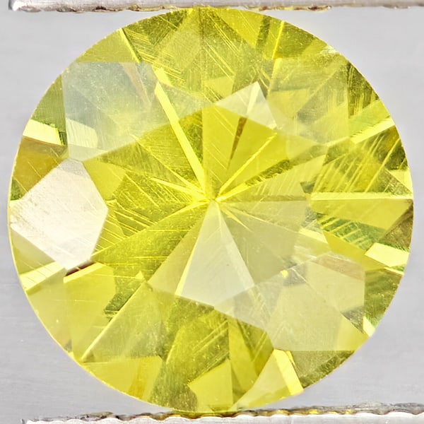 Natural Yellow Lemon Quartz 3.03 Ct. Round Diamond Cut 10.1 Mm Gemstone From Brazil: Product ID: 805530125 Product Name: Natural Quartz Weight: 3.03 CT. Size: 10.1 x 10.1 x 6.4 MM. Shape: Round Diamond Cut Color: Yellow Lemon Clarity:VSI Luster: Good Gems Origin: Brazil Treatment: Unh