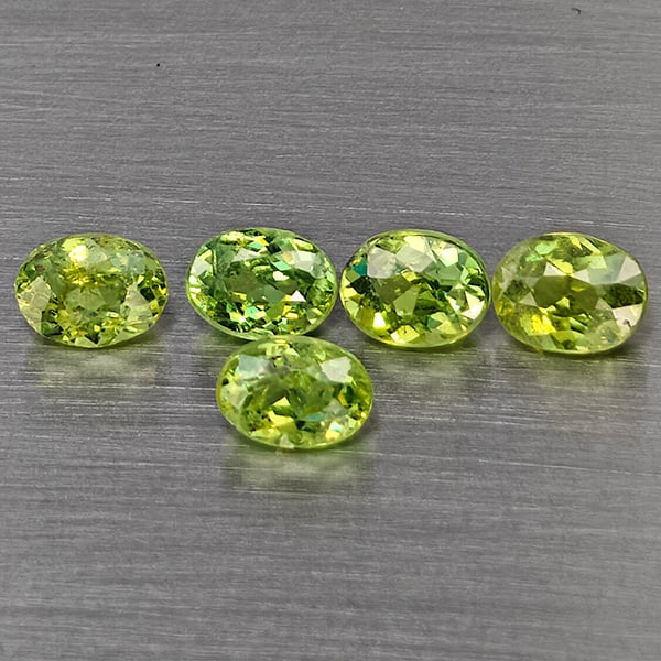 Natural Green Demantiod Garnet 1.25 Ct. 5 Pcs Oval Shape 4.2 x 3.2 Mm Gemstones From Madagascar: Product ID: 802937543 Product Name: Natural Demantoid Weight: 1.25 CT. Size: 4.2 x 3.2 x 2 MM. Shape: Oval Color: Green Clarity:SI1 Luster: Good Gems Origin: Madagascar Treatment: Unheated Crystal Str