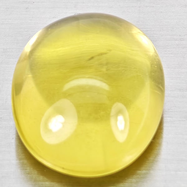 Natural Yellow Lemon Quartz 16.64 Ct.Oval Cabochon Shape 18.5 x 14.6 Mm Gemstone From Brazil: Product ID: 805530043 Product Name: Natural Quartz Weight: 16.64 CT. Size: 18.5 x 14.6 x 9.5 MM. Shape: Oval Cabochon Color: Yellow Clarity:Semi - Transparent Luster: Good Gems Origin: Brazil Treatmen