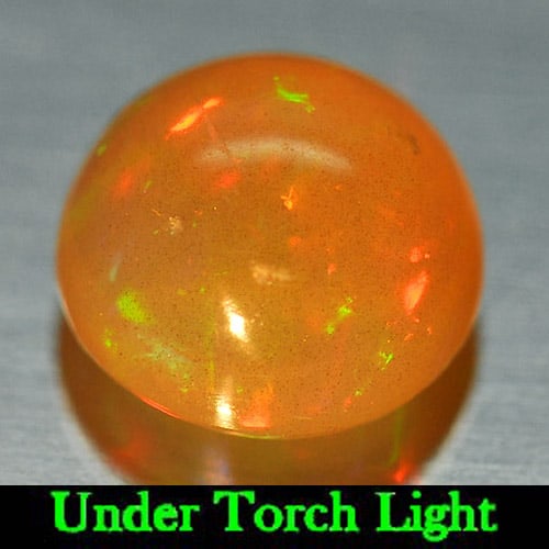 Natural Multi Color Opal 1.28 Ct. Round Cabochon Shape 7.7 Mm. Gemstone from Ethiopia: Product ID: 818725244 Product Name: Natural Opal Weight: 1.28 CT. Size: 7.7 x 7.7 x 4.8 MM. Shape: Round Cabochon Color: Multi Color Clarity:Semi - Transparent Luster: Iridescent Gems Origin: Ethiopia