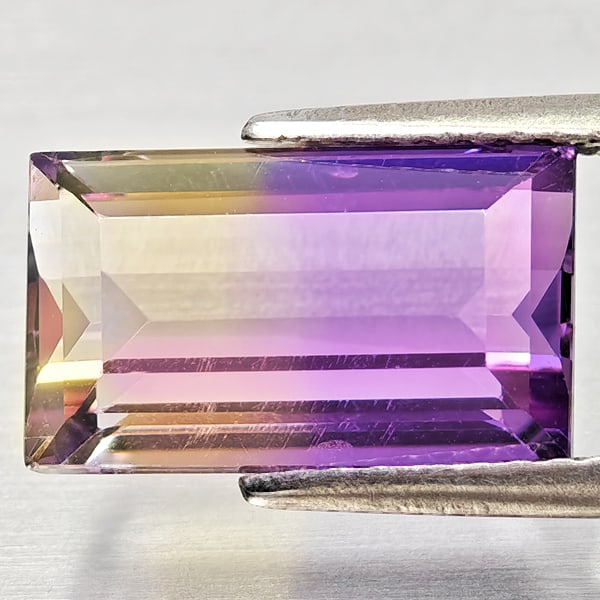 Natural Bi Color Ametrine 3.90 Ct. Octagon Shape 12 x 7.2 Mm Gemstone from Bolivia: Product ID: 800408349 Product Name: Natural Ametrine Weight: 3.90 CT. Size: 12 x 7.2 x 5.4 MM. Shape: Octagon Color: Bi Color Clarity:VSI Luster: Good Gems Origin: Bolivia Treatment: Unheated Crystal 