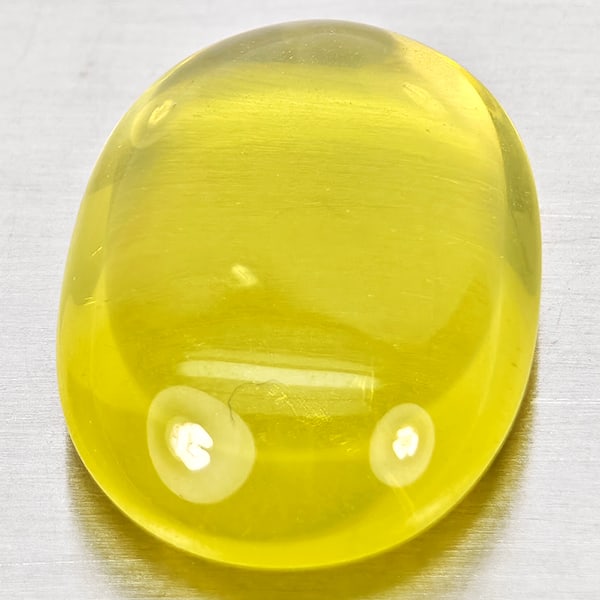 Natural Yellow Lemon Quartz 11.90 Ct.Oval Cabochon Shape 18.2 x 13.3 Mm Gemstone From Brazil: Product ID: 805530042 Product Name: Natural Quartz Weight: 11.90 CT. Size: 18.2 x 13.3 x 6.8 MM. Shape: Oval Cabochon Color: Yellow Clarity:Semi - Transparent Luster: Good Gems Origin: Brazil Treatmen