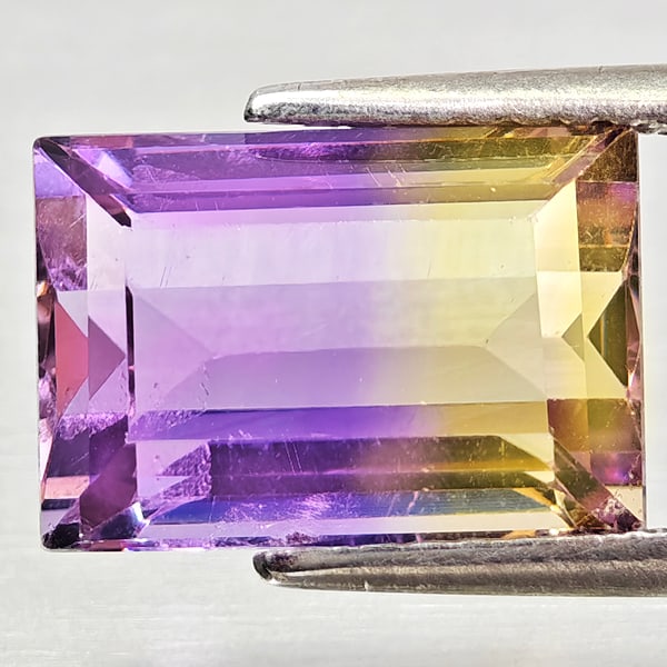 Natural Bi Color Ametrine 4.23 Ct. Octagon Shape 11.2 x 7.8 Mm Gemstone From Bolivia: Product ID: 800408332 Product Name: Natural Ametrine Weight: 4.23 CT. Size: 11.2 x 7.8 x 6 MM. Shape: Octagon Color: Bi Color Clarity:VSI - SI1 Luster: Good Gems Origin: Bolivia Treatment: Unheated Cr