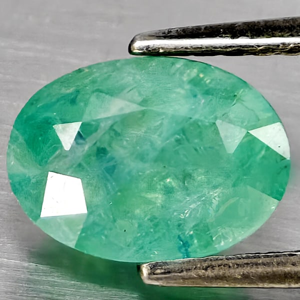 Natural Green Blueish Grandidierite 1.80 Ct. Oval Shape 8.5 x 6.4 Mm Gemstone from Madagascar: Product ID: 803100079 Product Name: Natural Tsavorite Weight: 1.80 CT. Size: 8.5 x 6.4 x 5.3 MM. Shape: Oval Shape Color: Green Blueish Clarity:SI1 Luster: Good Gems Origin: Madagascar Treatment: Unhe