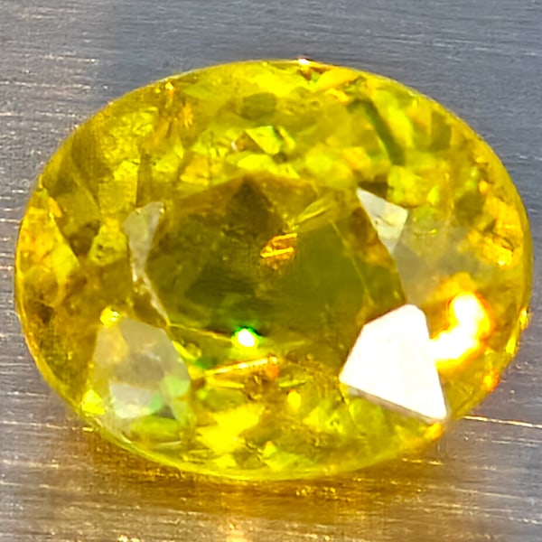 Natural Multi Color Sphene Rainbow Spark 1.15 Ct. Oval Shape 6.8 x 5.8 Mm Gemstone From Madagascar: Product ID: 806509065 Product Name: Natural Sphene Weight: 1.15 CT. Size: 6.8 x 5.8 x 3.8 MM. Shape: Oval Color: Multi-Color Clarity:SI1 Luster: Good Gems Origin: Madagascar Treatment: Unheated Crysta