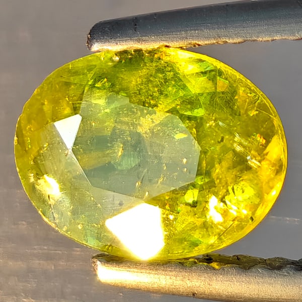 Natural Multi-Color With Rainbow Spark Sphene 1.31 Ct. Oval Shape 8.3 x 6.4 Mm Gemstone Madagascar: Product ID: 806509212 Product Name: Natural Sphene Weight: 1.31 CT. Size: 8.3 x 6.4 x 3.4 MM. Shape: Oval Shape Color: Multi-Color Clarity:SI1 Luster: Good Gems Origin: Madagascar Treatment: Unheated 