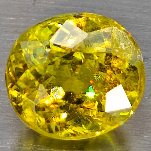 Natural Multi Color Sphene Rainbow Spark 1.64 Ct. Oval Shape 6.8 x 6.2 Mm. Gemstone From Madagascar: Product ID: 806509061 Product Name: Natural Sphene Weight: 1.64 CT. Size: 6.8 x 6.2 x 5.1 MM. Shape: Oval Color: Multi-Color Clarity:SI1 Luster: Good Gems Origin: Madagascar Treatment: Unheated Crysta