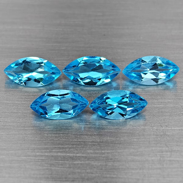 Natural Swiss Blue Topaz 6.21 Ct. 5 Pcs Marquise Shape 10 x 5.1 Mm Gemstone From Brazil: Product ID: 807168699 Product Name: Natural Blue Topaz Weight: 6.21 CT. Size: 10 x 5.1 x 4 MM. Shape: Marquise Shape Color: Swiss Blue Clarity:VSI Luster: Good Gems Origin: Brazil Treatment: Treated C