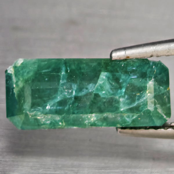 Natural Green Blueish Grandidierite 4.77 Ct. Octagon Shape 11.9 x 7 Mm Gemstone from Madagascar: Product ID: 803100002 Product Name: Natural Tsavorite Weight: 4.77 CT. Size: 14.9 x 7 x 5.5 MM. Shape: Octagon Color: Green Blueish Clarity:SI1 Luster: Good Gems Origin: Madagascar Treatment: Unheated