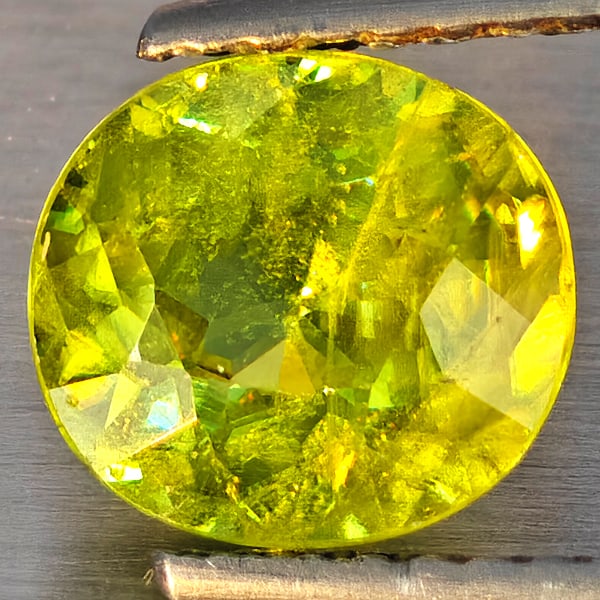 Natural Multi-Color Sphene With Rainbow Spark 1.72 Ct. Oval Shape 7.8 x 7.4 Mm Gemstone From: Product ID: 806509186 Product Name: Natural Sphene Weight: 1.72 CT. Size: 7.8 x 7.4 x 4.4 MM. Shape: Oval Shape Color: Multi-Color Clarity:SI1 Luster: Good Gems Origin: Madagascar Treatment: Unheated 